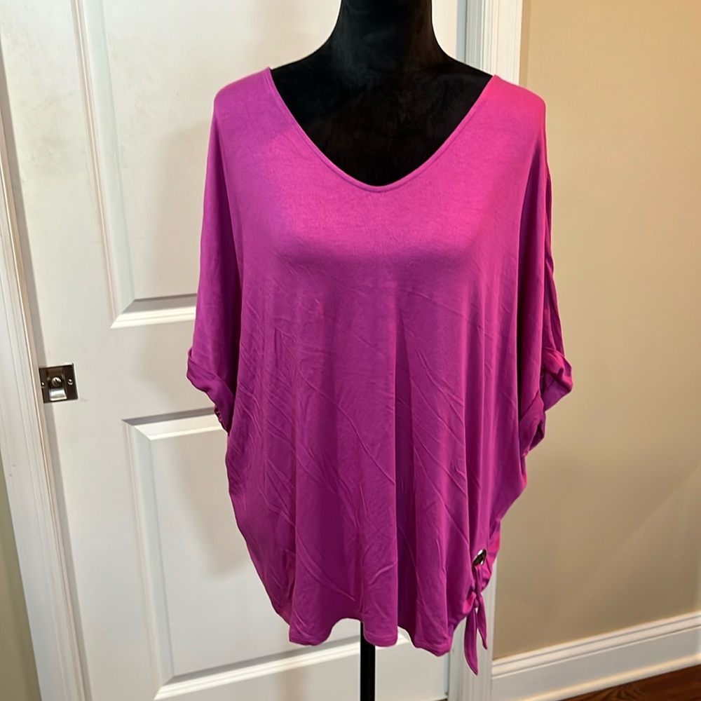 Studio short sleeve pink shirt. Sleeves decorated tie on the bottom. Brand new.